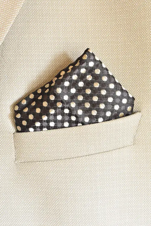Shop the Charcoal and Cream Polka Dot Pocket Square. A premium woven textured dark grey suit accessory with white dots designed for formal elegance.