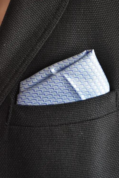 Shop the Sky Blue and Periwinkle Scalloped Wave Pocket Square. A premium woven textured suit accessory with an elegant interlocking fish-scale design.